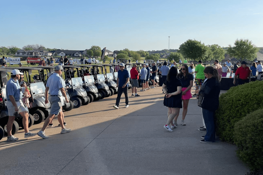 Golfers onsite at Harbor Lakes golf event